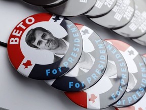 In this March 15, 2019, file photo, buttons for Democratic presidential candidate former Texas congressman Beto O'Rourke sit on display during a stop at the Central Park Coffee Company in Mount Pleasant, Iowa. O'Rourke entered the 2020 presidential race in mid-March as a political phenomenon, addressing overflow crowds around the country in off-the-cuff ways. Now, with that buzz cooling, O'Rourke is preparing a planned "re-introduction" that will see him do more national television appearances and concentrate on producing a series of detailed policy proposals.