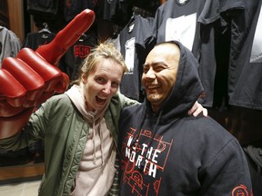 Tenzin Kalden (R) and his girlfriend Christine Burns were getting geared up for Game 3 of the NBA Eastern Conference final happening Sunday night between the Toronto Raptors and Milwaukee Bucks on Saturday May 18, 2019. Jack Boland/Toronto Sun/Postmedia Network