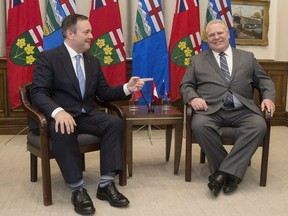 Ontario Premier Doug Ford, right, poses with Alberta Premier Jason Kenney at the Ontario Legislature in Toronto on Friday, May 3, 2019. (THE CANADIAN PRESS/Chris Young)
