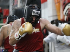 Mortgage broker Deren Hasip, 41, works the heavy bag during a training session at the Kingsway Boxing Club on Thursday, April 25, 2019. He and nine other working professionals have spent months learning to box in preparation for the 8th annual Fight to End Cancer being held at the Old Mill Toronto on June 1, 2019. (Jack Boland/Toronto Sun/Postmedia Network)
