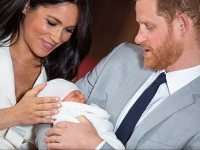 WINDSOR, ENGLAND - MAY 08: Prince Harry, Duke of Sussex and Meghan, Duchess of Sussex, pose with their newborn son Prince Archie Harrison Mountbatten-Windsor during a photocall in St George's Hall at Windsor Castle on May 8, 2019 in Windsor, England. The Duchess of Sussex gave birth at 05:26 on Monday 06 May, 2019. (Photo by Dominic Lipinski - WPA Pool/Getty Images)