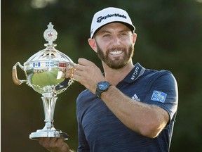 Dustin Johnson, of the United States, hoists the Canadian Open championship trophy at the Glen Abbey Golf Club in Oakville Ont., on Sunday, July 29, 2018.The RBC Canadian Open is less than a month away and already it's shaping up to be one of the most competitive fields in the storied tournament's recent history.