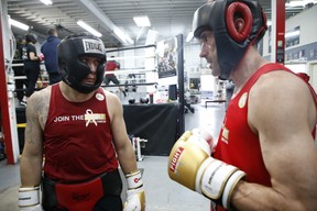 Deren Hasip (left) stares down his FTEC 2019 opponent Paul Agapito (right) during a training session at the Kingsway Boxing Club on Thursday, April 25, 2019. (Jack Boland/Toronto Sun/Postmedia Network)