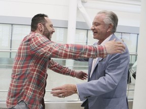 Herbie Quinones is greeted by Paul Godfrey at Toronto Pearson International Airport on Friday May 24, 2019. (Veronica Henri/Toronto Sun/Postmedia Network)