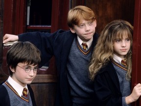 Daniel Radcliffe, Rupert Grint and Emma Watson in a scene from Harry Potter and the Philosopher's Stone.