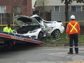 Toronto Police remove a white Mercedes following a deadly crash on Brimley Rd. in Scarborough early May 10, 2019. (Kevin Connor/Toronto Sun)