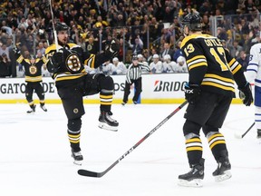 Bruins forward Marcus Johansson (left) celebrates with teammate Charlie Coyle (right) after scoring a goal against the Maple Leafs in Game 7 of a first round playoff series at TD Garden in Boston on April 23, 2019.