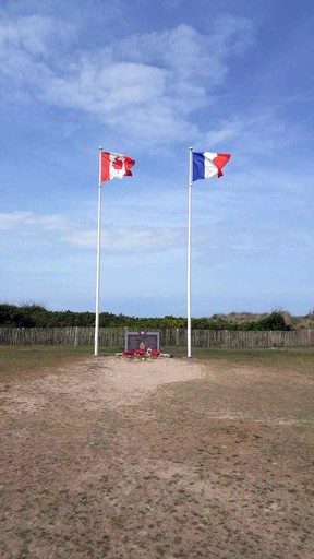 The Canadian and French flags are flown proudly on the grounds of the Juno Beach Centre in Courseulles-sur-Mer. (DAVE POLLARD/Postmedia Network)