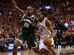 Bucks Khris Middleton and Raptors Kawai Leonard in Game 3 on Sunday. JACK BOLAND/TORONTO SUN