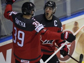 Canada's Kyle Turris, right, celebrates with Anthony Mantha, left, after scoring a goal during the Ice Hockey World Championships Group A match against the United States at the Steel Arena in Kosice, Slovakia, Tuesday, May 21, 2019.