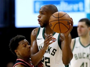 Raptors’ Kyle Lowry gets a face full of elbow from Bucks’ Khris Middleton during Game 2 of their Eastern Conference final on Friday night at Fiserv Forum in Milwaukee. (Getty Images)