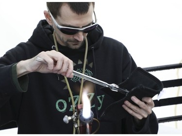 Mastahlaglass makes a glass pipe at the Global Marijuana March Toronto took place at the top of Queens Park Circle  - with pop-up vendors and cannabis users - before heading north to Bloor St.W. with about 500 participants   on Saturday May 4, 2019. Jack Boland/Toronto Sun/Postmedia Network