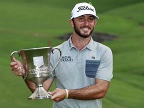 Max Homa poses with the trophy after winning the Wells Fargo Championship at Quail Hollow Club in Charlotte, N.C., Sunday, May 5, 2019.