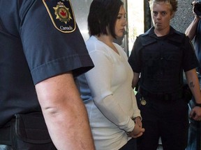 Terri-Lynne McClintic, convicted in the death of eight-year-old Woodstock, Ont., girl Victoria Stafford, is escorted into court in Kitchener, Ont., on Wednesday, September 12, 2012 for her trial in an assault on another inmate while in prison. A woman serving a life sentence for the murder of eight-year-old Tori Stafford says her move from a healing lodge to a prison was unfair.