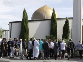 In this March 23, 2019 file photo, worshippers prepare to enter the Al Noor mosque a week after a mass shooting in Christchurch, New Zealand.