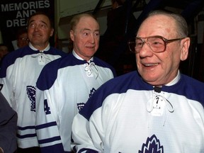 Former Toronto Maple Leafs stars Frank Mahovlich (Left), Red Kelly and Johnny Bower (Right) take a final look at the depths of Maple Leaf Gardens as they prepare to head on to the ice for the closing ceremonies following the Leafs final game in the Gardens. (THE CANADIAN PRESS/Frank Gunn)