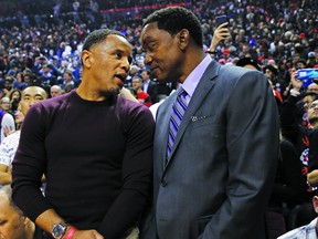 Former Raptor Damon Stoudamire speaks with Isiah Thomas during the first half of last night's Game 1 in Toronto, Ont. on Thursday May 30, 2019. Jack Boland/Toronto Sun/Postmedia Network