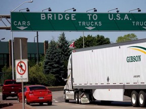 Traffic makes its way to Ambassador Bridge that connects Canada to the United States Windsor Ont. on Friday June 15, 2012. Ontario is proposing to eliminate an enhanced driver's licence that allows people to enter the United States at land and water border crossings without a passport. THE CANADIAN PRESS/Mark Spowart