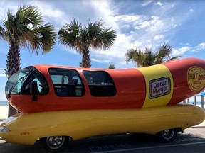 A Wienermobile on the road.