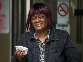 Sharon Shaw, mother of  Shakiyl and Lenneil Shaw, both 25, who were found guilty of first-degree murder in the shooting death of  teen Jarryl Hagley at a Pizza Pizza outlet more than two years ago, cries as she steps out of  courthouse at 361 University Ave., following the verdict on Thursday May 23, 2019.