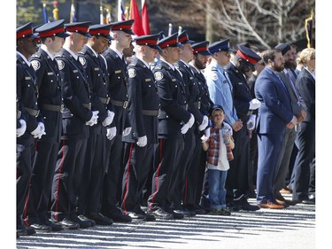 Members of the Toronto Police stand at attention at the 20th annual Ontario Police Memorial Foundation ceremony held at Queens Park honours the 266 officers who have fallen in the line of duty over the years on Sunday May 5, 2019. Jack Boland/Toronto Sun/Postmedia Network