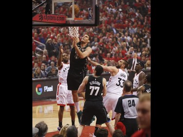 Milwaukee Bucks Brook Lopez C (11) jams a ball past Toronto Raptors Marc Gasol C (33) during the first half  in Toronto, Ont. on Saturday May 25, 2019. Jack Boland/Toronto Sun/Postmedia Network