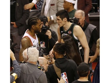 Toronto Raptors Kawhi Leonard SF (2) shakes hands with Milwaukee Bucks Ersan Ilyasova PF (77) after the game in Toronto, Ont. on Saturday May 25, 2019. Jack Boland/Toronto Sun/Postmedia Network