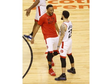 Toronto Raptors Norman Powell SF (24) goes celebrate with teammate Fred VanVleet PG (23) after the game in Toronto, Ont. on Saturday May 25, 2019. Jack Boland/Toronto Sun/Postmedia Network