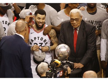 Toronto Raptors Fred VanVleet PG (23) is excited as he spies the Eastern Conference champions trophy with Wayne Embry (R)   in Toronto, Ont. on Saturday May 25, 2019. Jack Boland/Toronto Sun/Postmedia Network