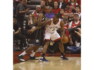 Toronto Raptors Kawhi Leonard SF (2) guarded during the first half  in Toronto, Ont. on Saturday May 25, 2019. Jack Boland/Toronto Sun/Postmedia Network