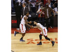 Toronto Raptors Kawhi Leonard SF (2) shakes hands with Fred VanVleet PG (23) during the third quarter in Toronto, Ont. on Sunday, May 12, 2019