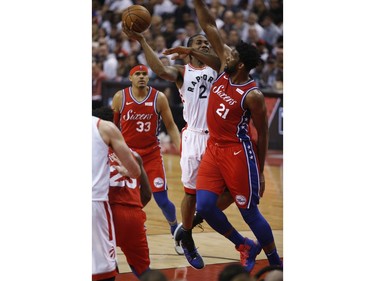 Toronto Raptors Kawhi Leonard SF (2) in on Philadelphia 76ers Joel Embiid C (21) during the first half in Toronto, Ont. on Sunday May 12, 2019. Jack Boland/Toronto Sun/Postmedia Network