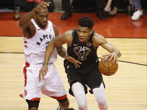 Toronto Raptors Kawhi Leonard SF (2) tries to guard Milwaukee Bucks Giannis Antetokounmpo PF (34) during the first half  in Toronto, Ont. on Saturday May 25, 2019. Jack Boland/Toronto Sun/Postmedia Network