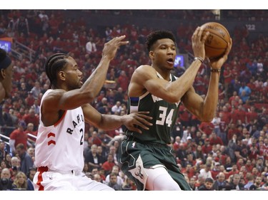 Toronto Raptors Kawhi Leonard SF (2) defends against Milwaukee Bucks Giannis Antetokounmpo PF (34) during first quarter in Toronto, Ont. on Sunday May 19, 2019. Jack Boland/Toronto Sun/Postmedia Network