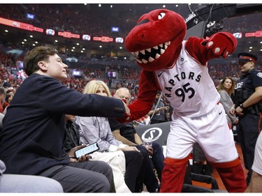 The Raptors says hello to Canadian film superstar Mike Myers during first quarter in Toronto, Ont. on Sunday May 19, 2019. Jack Boland/Toronto Sun/Postmedia Network