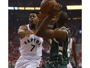 Toronto Raptors Kyle Lowry PG (7) tries to block Milwaukee Bucks Sterling Brown SG (23) during first quarter in Toronto, Ont. on Sunday May 19, 2019. Jack Boland/Toronto Sun/Postmedia Network