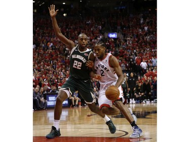 Milwaukee Bucks Khris Middleton SF (22) guards against Toronto Raptors Kawhi Leonard SF (2) during fourth quarter in Toronto, Ont. on Sunday May 19, 2019. Jack Boland/Toronto Sun/Postmedia Network