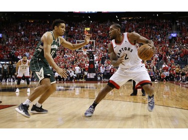 Milwaukee Bucks Malcolm Brogdon (13) guards against Toronto Raptors Kawhi Leonard SF (2) during fourth quarter in Toronto, Ont. on Sunday May 19, 2019. Jack Boland/Toronto Sun/Postmedia Network