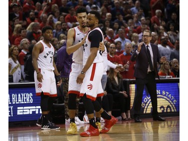 Toronto Raptors Norman Powell SF (24) is console by teammate Danny Green G (14) after fouling out during fourth  quarter in Toronto, Ont. on Sunday May 19, 2019. Jack Boland/Toronto Sun/Postmedia Network