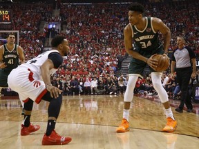 Toronto Raptors Norman Powell goes up against Giannis Antetokounmpo of the Bucks during the first quarter in Toronto, Ont. on Sunday May 19, 2019. Jack Boland/Toronto Sun/Postmedia Network