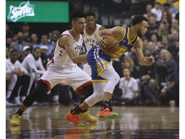 Golden State Warriors Stephen Curry PG (30) goes around Toronto Raptors Danny Green SG (14) during the first half media in Toronto, Ont. on Thursday May 30, 2019. Jack Boland/Toronto Sun/Postmedia Network