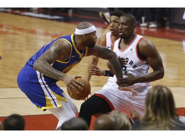 Toronto Raptors Serge Ibaka C (9) tries to block Golden State Warriors Stephen Curry PG (30) during the first half media in Toronto, Ont. on Thursday May 30, 2019. Jack Boland/Toronto Sun/Postmedia Network