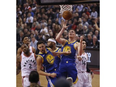 Golden State Warriors Klay Thompson SG (11) and teammate Jonas Jerebko PF (21) spin off scoring a bucket during the first half media in Toronto, Ont. on Thursday May 30, 2019. Jack Boland/Toronto Sun/Postmedia Network