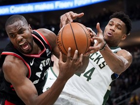 Milwaukee Bucks' Giannis Antetokounmpo tries to steal the ball from Toronto Raptors' Serge Ibaka during the second half of Game 2 of the NBA Eastern Conference basketball playoff finals Friday, May 17, 2019, in Milwaukee. The Bucks won 125-103 to take a 2-0 lead in the series.