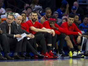 Raptors players look on from the bench during Game 3 against the 76ers in Philadelphia. The Raps were outclassed in the game and must find a new gear for Sunday’s Game 4. (GETTY IMAGES)