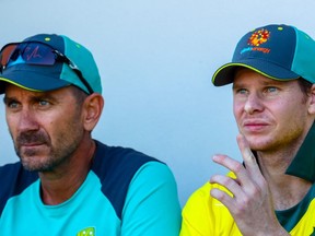 Australia's coach Justin Langer (left) and Steve Smith look on during a one-day cricket practice match between Australia and New Zealand in Brisbane on May 6, 2019. (PATRICK HAMILTON/Getty Images
