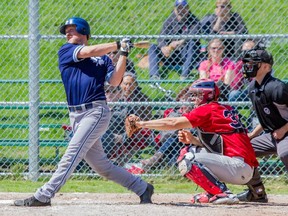 Maple Leafs’ Marcus Knecht takes a big rip at the ball during yesterday’s 11-7 opening-day loss to the Brantford Red Sox at Chistie Pits. MAX LEWIS/PHOTO