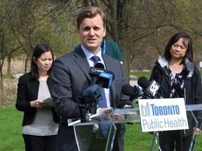 Toronto Health Board Chair Joe Cressy speaks a press conference in  in Morningside Park in Scarborough on Thursday.  Joined by Toronto Public Health Associate Medical Officer of Health Dr. Christine Navarro (left) and Toronto Public Health Manager Elaine Pacheco (right) he warned Torontonians to take precautions against tick bites this summer.