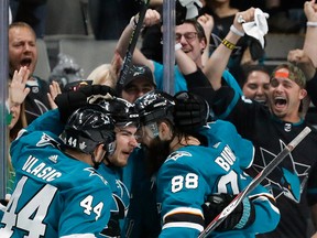 San Jose Sharks' Marc-Edouard Vlasic, Timo Meier and Brent Burns celebrate a goal by Meier against the St. Louis Blues in the second period in Game 1 of the NHL hockey Stanley Cup Western Conference finals in San Jose, Calif., Saturday, May 11, 2019.