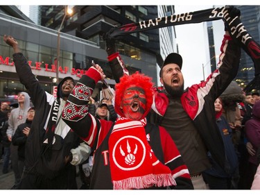 The Toronto Raptors' faithful  fans celebrate  in Jurassic Park as their Raptors play against the Philadelphia 76ers, in Toronto, Ont. on Sunday, May 12, 2019